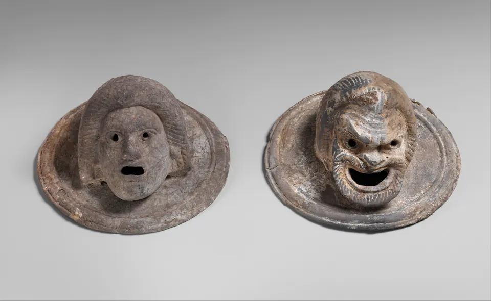 Medallones con forma de máscaras teatrales